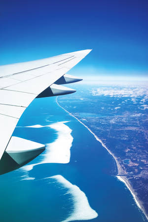Aerial Photo Of Airplane Wings During Daytime Wallpaper