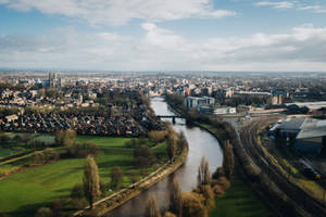 Aerial Photography Of Body Of Water Near City At Daytime Wallpaper