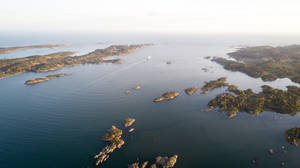 Aerial Photography Of Island During Daytime Wallpaper