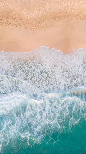 Aerial Photography Of Waves Splashing On White Sand Beach Wallpaper