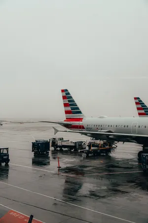 Aerial View Of A Wet Airplane Ramp At An Airport Wallpaper