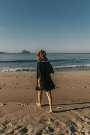 Aesthetic Beach Woman On The Shore Wallpaper