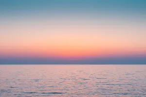 Aesthetic Sky Over Sea Of Water Wallpaper