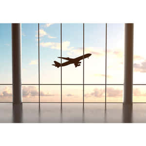 Airplane Climbing After Departure From The Terminal Wallpaper