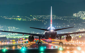 Airport With City Lights View Wallpaper