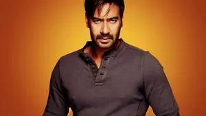 Ajay Devgn Fiery Orange Background Wallpaper