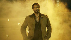 Ajay Devgn In Brown Jacket Outfit Wallpaper