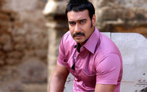 Ajay Devgn In Pink Shirt Outfit Wallpaper