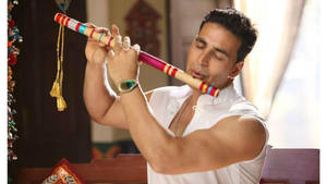 Akshay Kumar Playing Flute Wallpaper