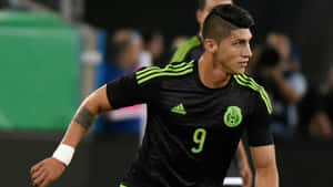 Alan Pulido In Black Adidas Jersey Wallpaper