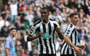 Alexander Isak With Clenched Fists Wallpaper