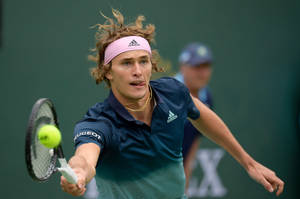 Alexander Zverev Biting Tongue In Intense Moment Wallpaper