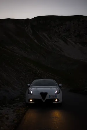 Alfa Romeo Giulietta Illuminated At Night Wallpaper