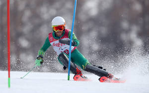 Alpine Skiing Green Suit Wallpaper