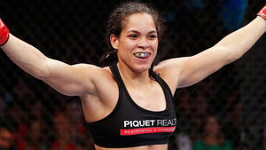 Amanda Nunes Arms Up Wallpaper