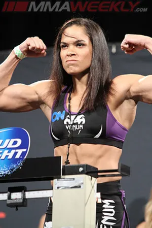 Amanda Nunes Flex On Stage Wallpaper