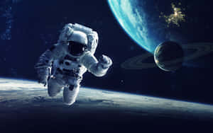 Amazing Astronaut Taking In The Beauty Of Space Wallpaper