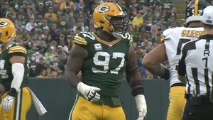 American Football Defensive Tackle Kenny Clark Medium Angle Shot Wallpaper