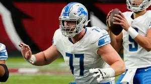 American Footballer Frank Ragnow With Teammates Wallpaper