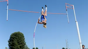 American Pole Vault Athlete Paige Sommers In Action Wallpaper