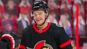 American Smiling Hockey Player Josh Norris Wallpaper