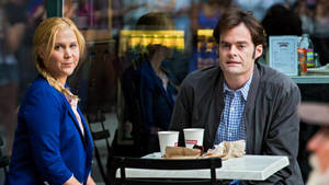 Amy Schumer And Bill Hader On A Coffee Date In Trainwreck Movie Wallpaper