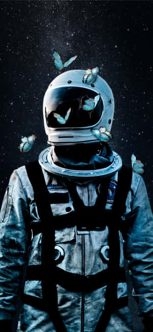 An Astronaut With Butterflies Flying Around Him Wallpaper