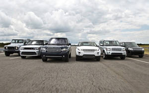 An Exclusive Fleet Of Land Rover Vehicles Wallpaper