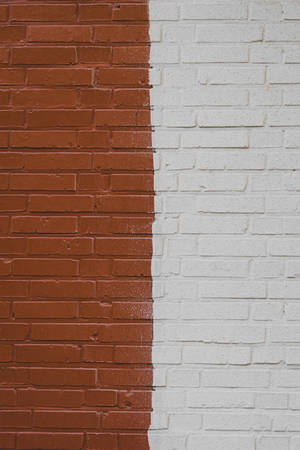 An Eye-catching Half White And Half Brown Brick Wall Wallpaper