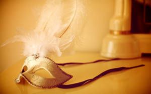 An Ornate Gold Mask Wallpaper