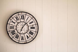 Analog Wall Clock On Wall Wallpaper