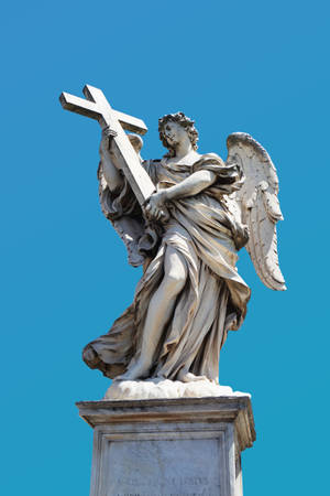 Angel Holding Cross Statue During Day Wallpaper