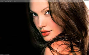 Angelina Jolie Looking Over Her Shoulder Wallpaper