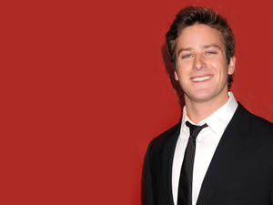 Armie Hammer In Red Background Wallpaper