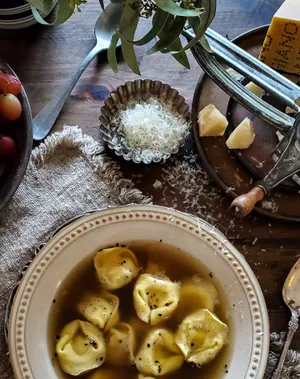 Aromatic Tortellini In Brodo Served On A Table Wallpaper