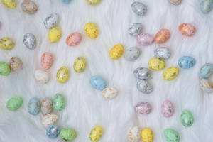 Assorted-color Easter Eggs On White Textile Wallpaper