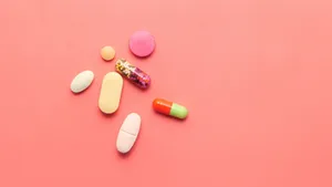 Assorted Medications Pink Background Wallpaper