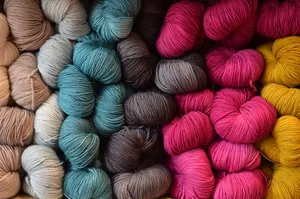 Assorted Multi-colored Knitworks And Varied Knitting Yarns Wallpaper