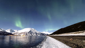 Aurora Borealis In Winter Aesthetic Wallpaper