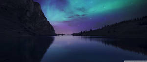 Aurora Borealis Lights Up The Dark Winter Sky Wallpaper