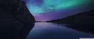 Aurora Borealis Lights Up The Dark Winter Sky Wallpaper