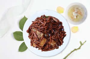 Authentic Dark Hokkien Mee On A White Plate Wallpaper