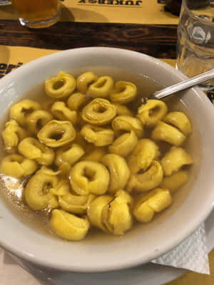 Authentic Tortellini In Brodo Served In A Restaurant Wallpaper