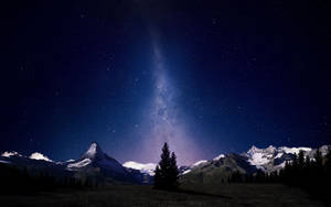 Awestruck By The Miracle Of The Swiss Alps Night Sky Wallpaper