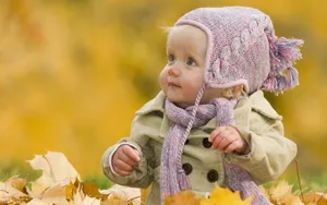 Baby Photography With Pile Of Leaves Wallpaper