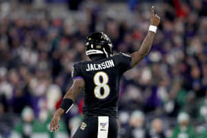 Baltimore Ravens Quarterback Lamar Jackson Celebrates The Teams Winning Drive Of The 2019 Season Wallpaper