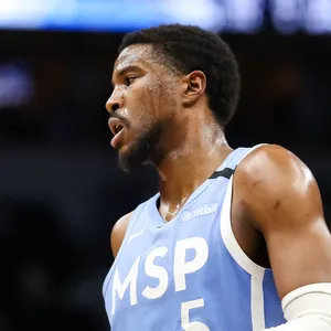 Basketball Player Malik Beasley Against Denver Nuggets Wallpaper