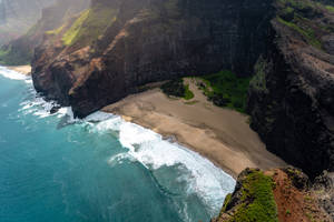 Beach By A Mountain Full Screen Desktop Wallpaper