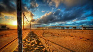 Beach Volleyball Court Near A Pier Wallpaper