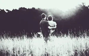 Beautiful Black Couple Embracing Each Other Wallpaper